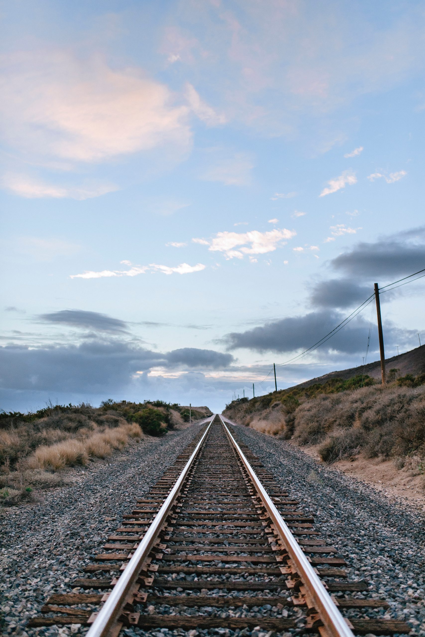 Flat train tracks looking into the distance with no end in sight