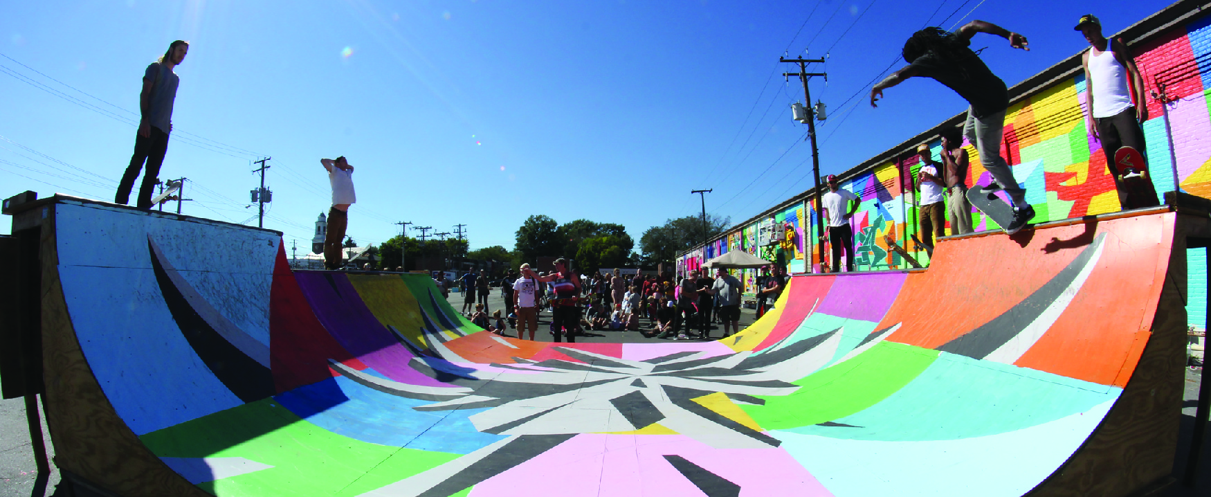 A photograph shows skateboarders on a skateboarding ramp.