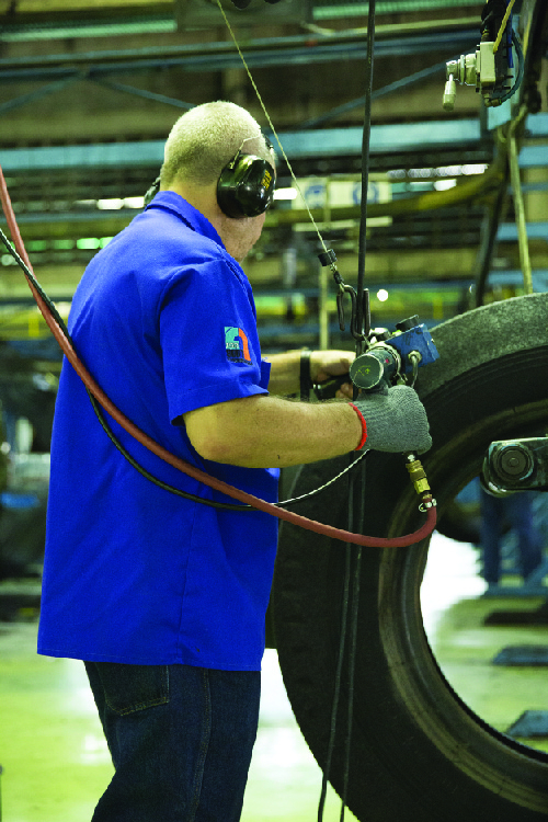 Photograph of an automobile worker.